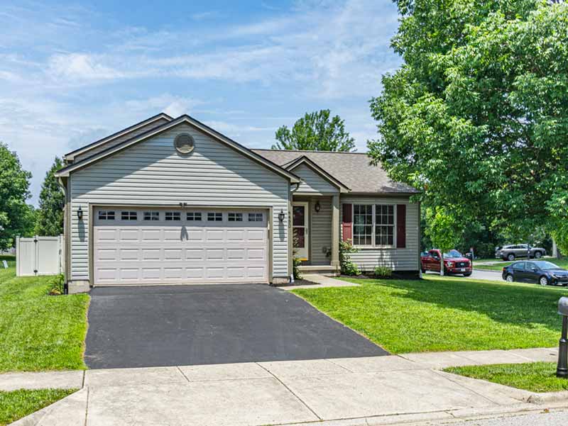 Ohio Prospective buyers touring a bright and staged home during an open house in Dublin, Ohio.