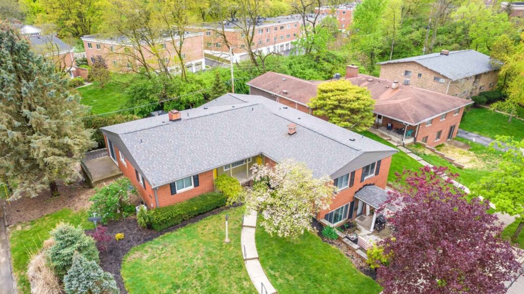 aerial view of home roof inspection using drone